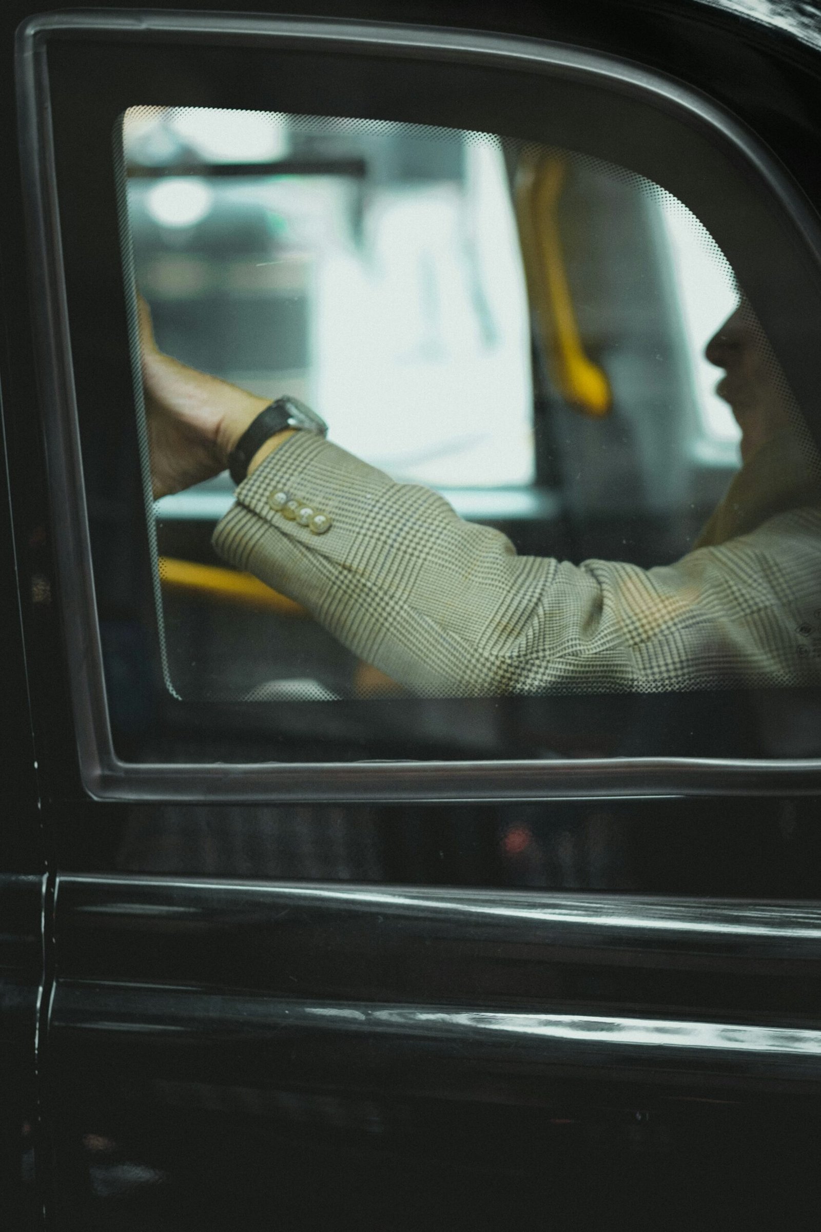 A closeup shot of a man traveling in a cab
