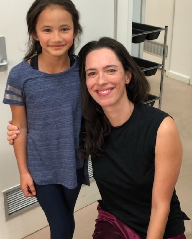 Kaylee Hottle and Rebecca Hall smile together in a behind-the-scenes photo shared by Rebecca following Kaylee's death. Rebecca posted several images from their time working together on the "Godzilla" films as part of her tribute.