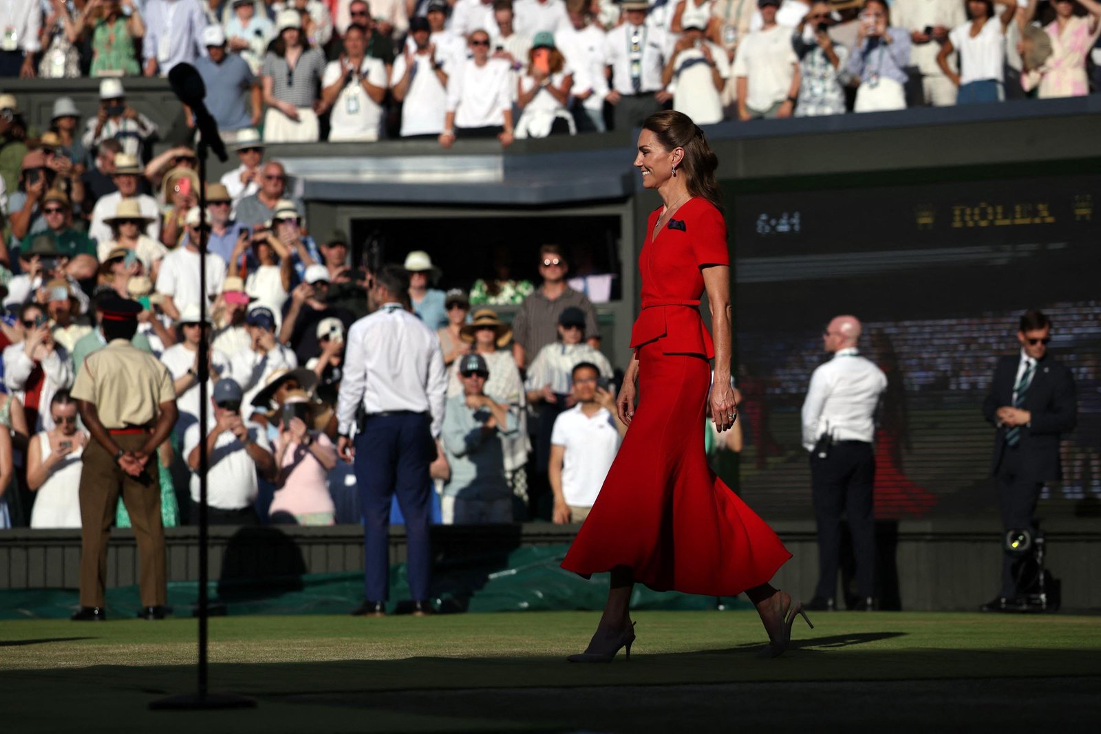 Walking onto Centre Court, Catherine prepared to present the trophy after the women's singles final. The ceremony is one of the most anticipated traditions of Wimbledon weekend.