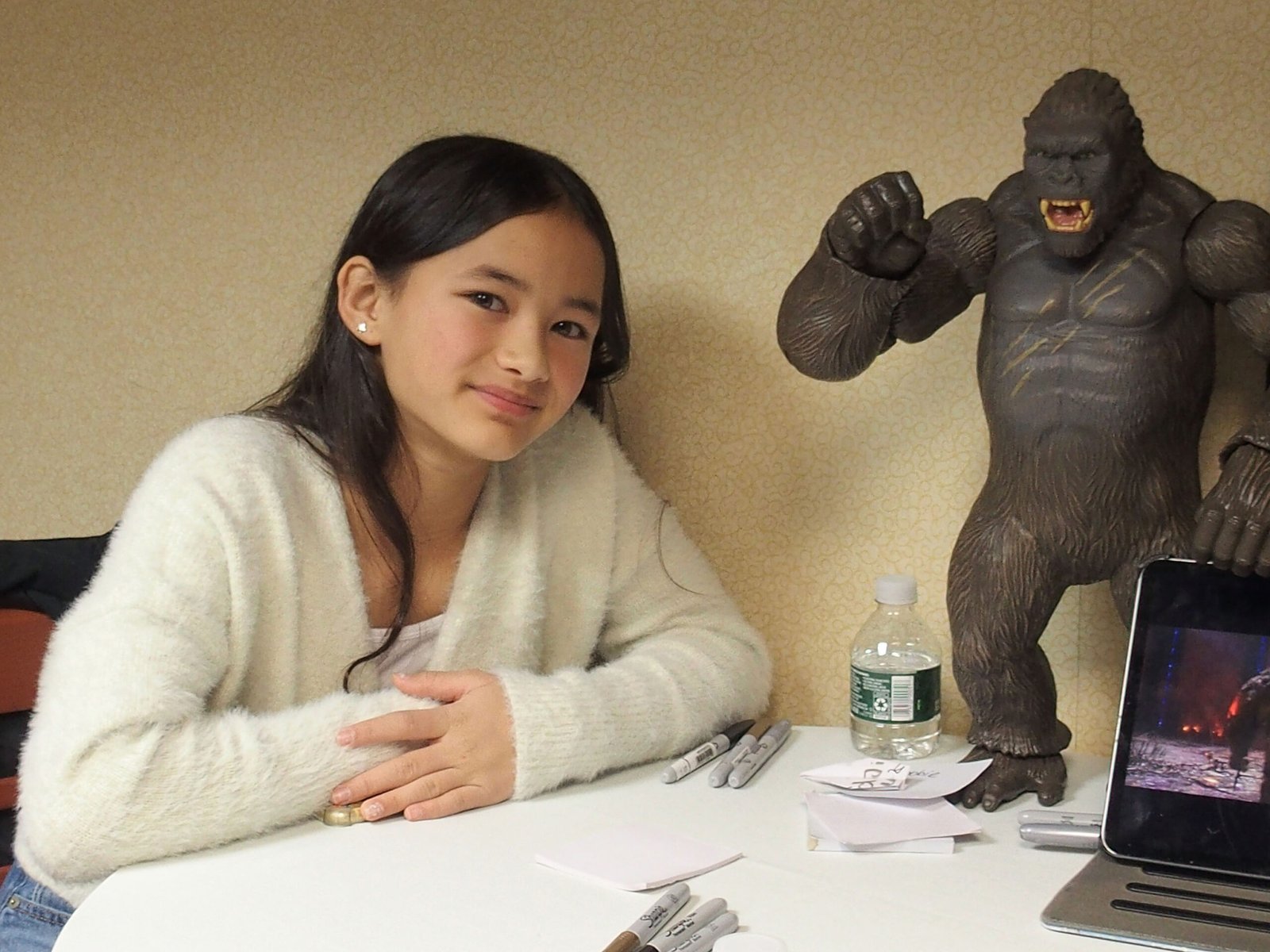 Kaylee Hottle poses beside a King Kong figure during the 2021 Northeast Comic Con & Collectibles Extravaganza in Boxborough, Massachusetts. The appearance came months after the release of "Godzilla vs. Kong," the film that launched her acting career.
