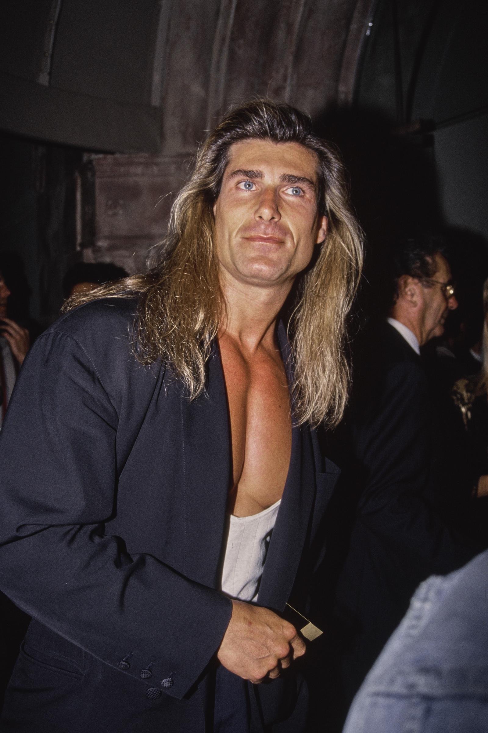 Another opportunity came just as quickly for the male model. In this photo, the iconic romance book cover star attended the "Pauly Does Dallas" premiere after party at the Comedy Store in Los Angeles, California, on August 26, 1992.