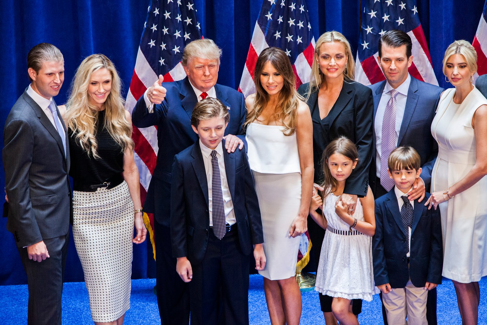 Eric Trump, Lara Yunaska Trump, Donald Trump, Barron Trump, Melania Trump, Vanessa Haydon Trump, Kai Madison Trump, Donald Trump Jr., Donald John Trump III, and Ivanka Trump pose for photos on stage after Donald Trump announced his candidacy for the U.S. presidency at Trump Tower on June 16, 2015 in New York City