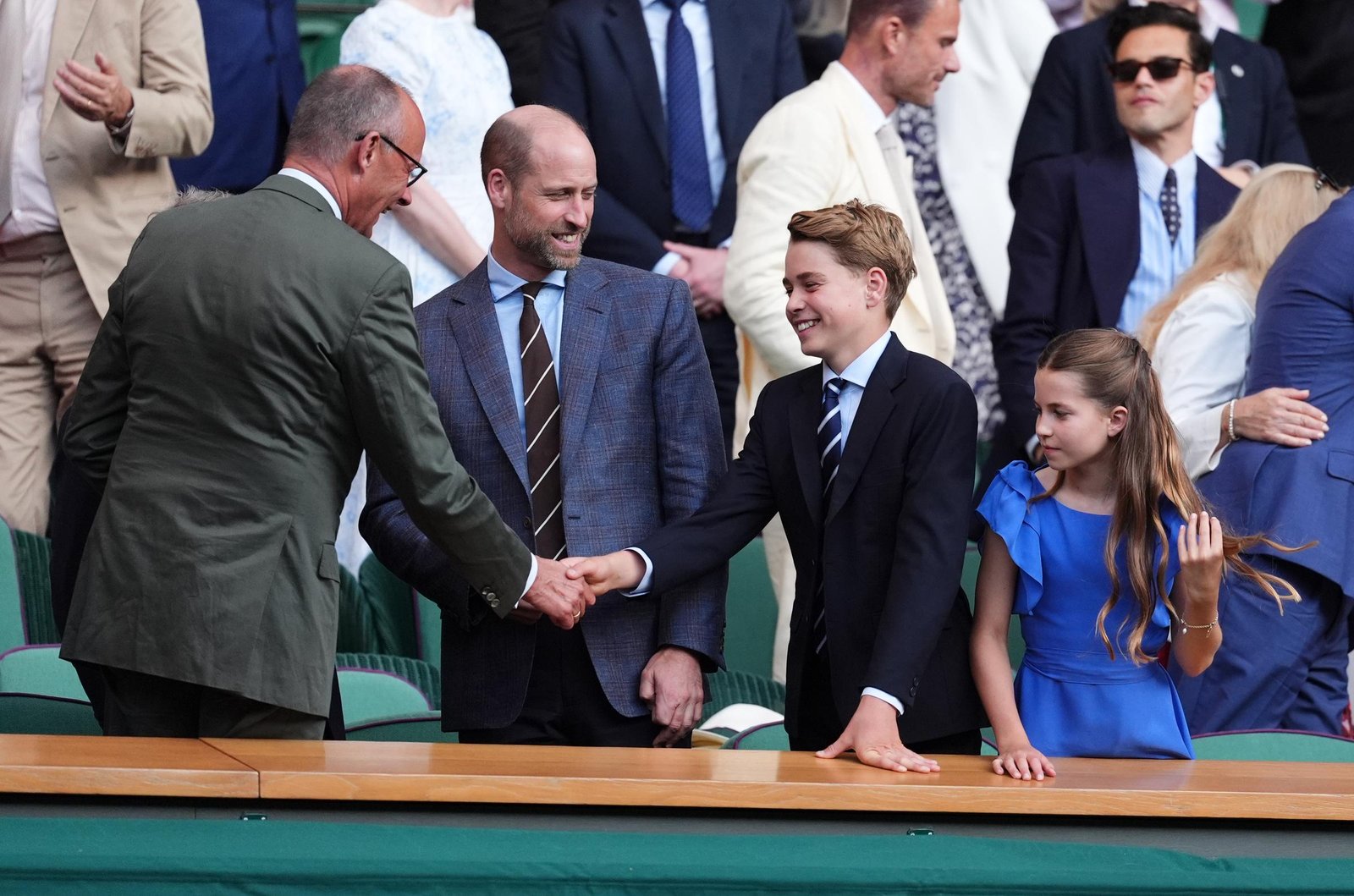 Prince George greeted German Chancellor Friedrich Merz before taking his seat in the Royal Box. The moment highlighted the formal traditions that accompany Wimbledon finals.
