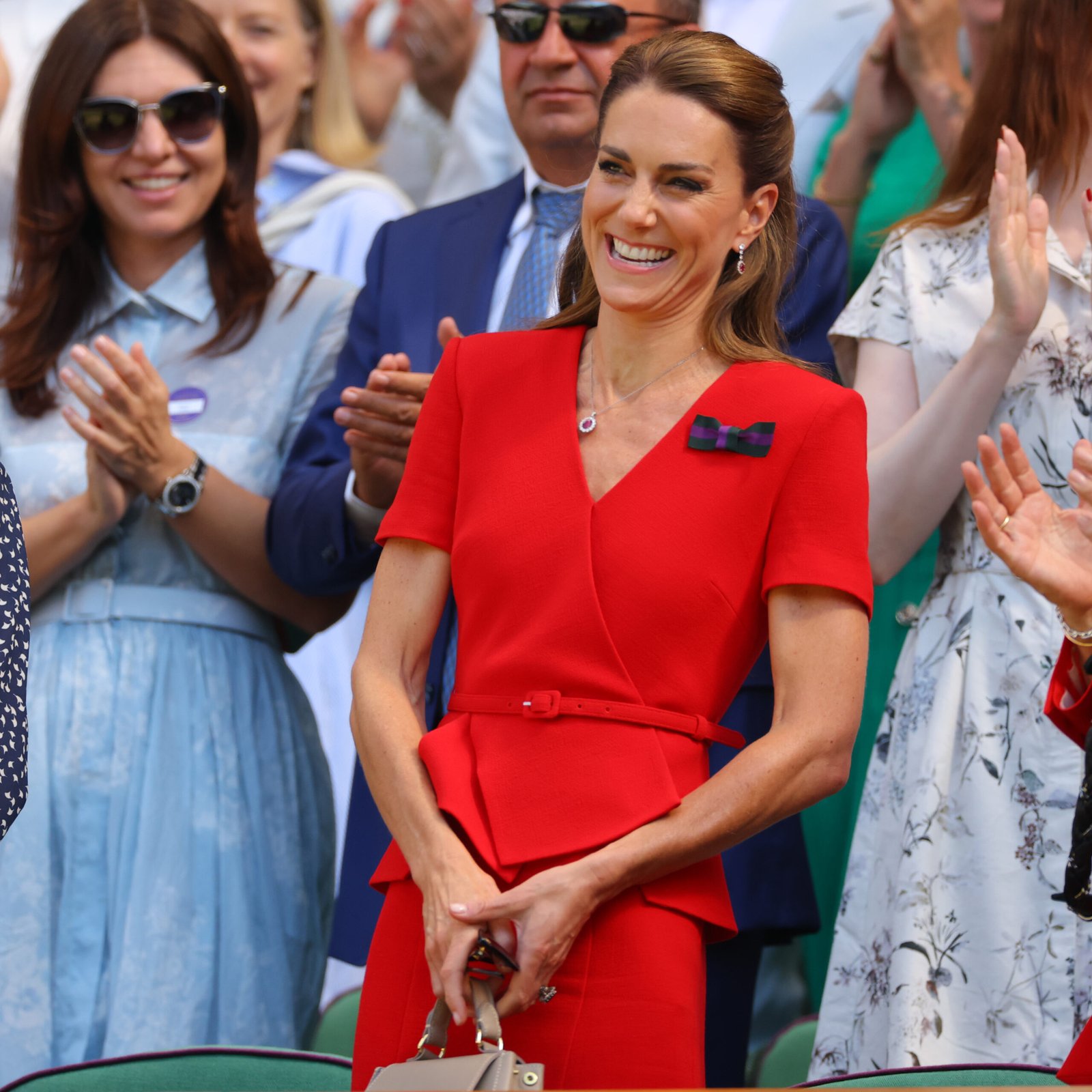 Catherine's second Wimbledon appearance drew attention because she switched from a tailored suit to a bold red dress. The brighter color made this look feel completely different from her opening-day outfit.