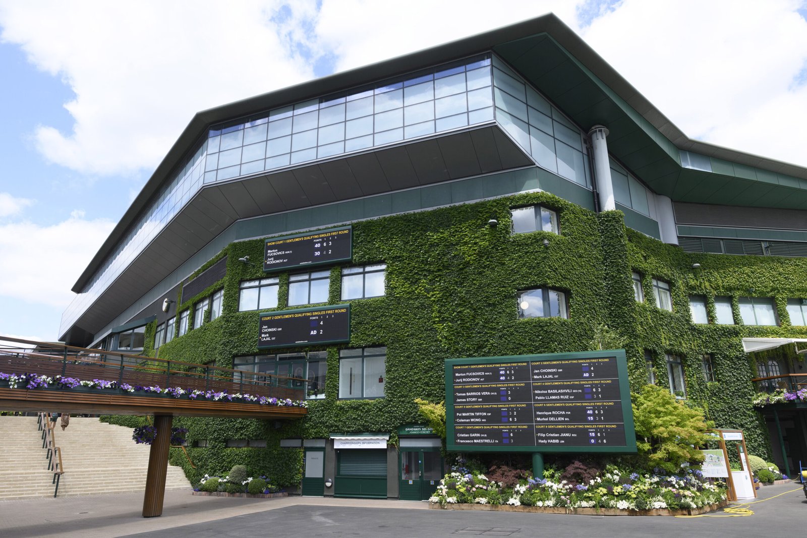 The All England Club is closely associated with Catherine's Wimbledon appearances. Each year, fans look beyond the matches to see what she wears, including the purple-and-green Wimbledon bow pinned to her outfit.