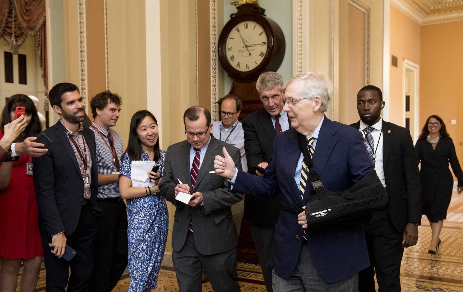McConnell returned to the Senate wearing a sling after undergoing surgery to repair a fractured shoulder caused by a fall at his Kentucky home. The injury marked one of several health setbacks that would later draw renewed public attention.