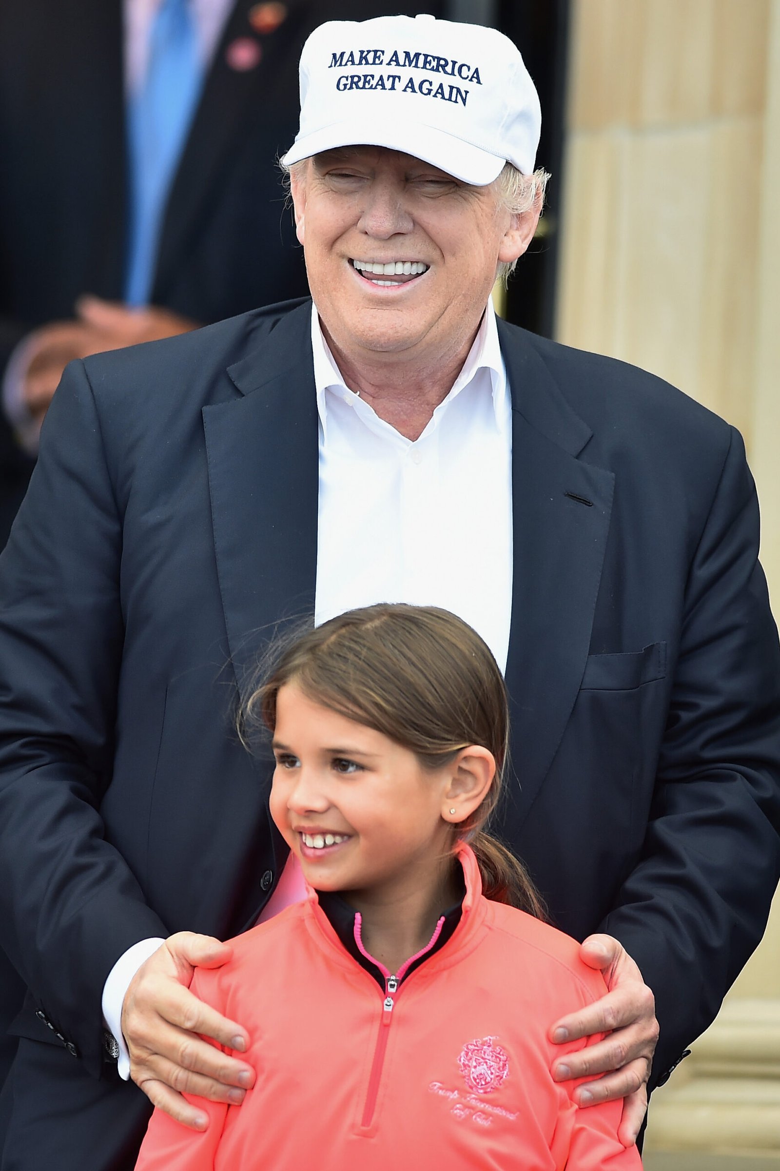 Donald Trump and his granddaughter Kai Trump arrive at his Trump Turnberry Resort on June 24, 2016 in Ayr, Scotland