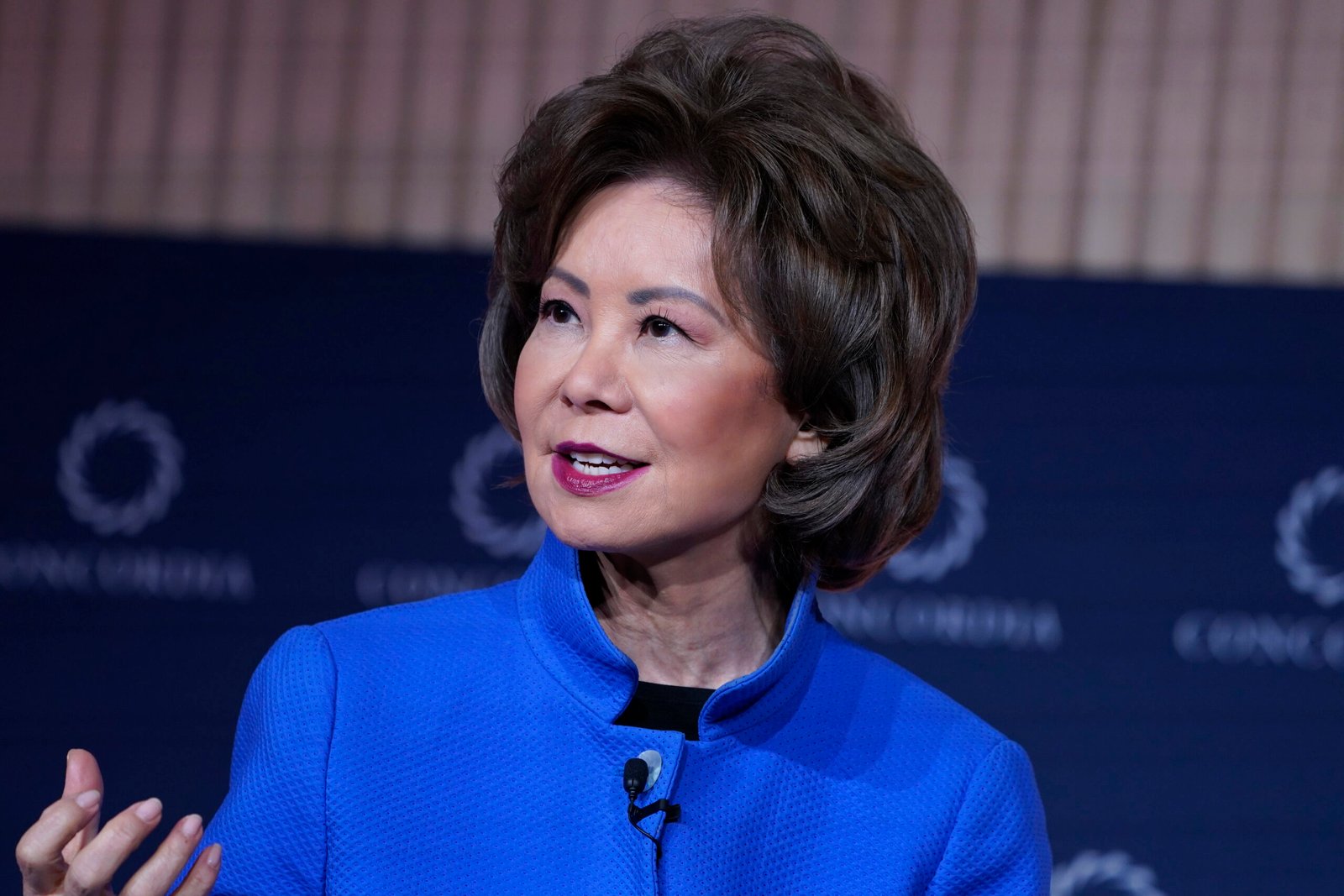 Elaine Chao speaks during a public appearance, as her representative later explained why she did not immediately return from China following Mitch McConnell's hospitalization.